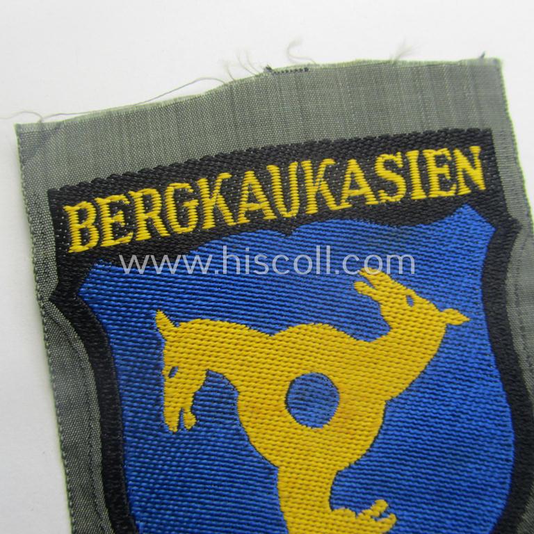 'BeVo'-type armshield (of the second pattern!) entitled: 'Bergkaukasien', being a piece as intended for a volunteer who served within the 'Deutsche Wehrmacht' ie. within the 'Berg- o. Nord-Kaukasisches Legion'