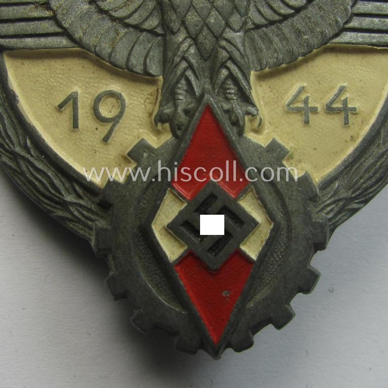 Superb - and truly scarcely encountered! - 'Feinzink'-based HJ (ie. 'Hitlerjugend') so-called: 'Reichsberufswettkampf-Siegerabzeichen' of the 2nd model, 'Gausieger 1944', being a clearly maker- (ie.: 'Gustav Brehmer'-) marked example
