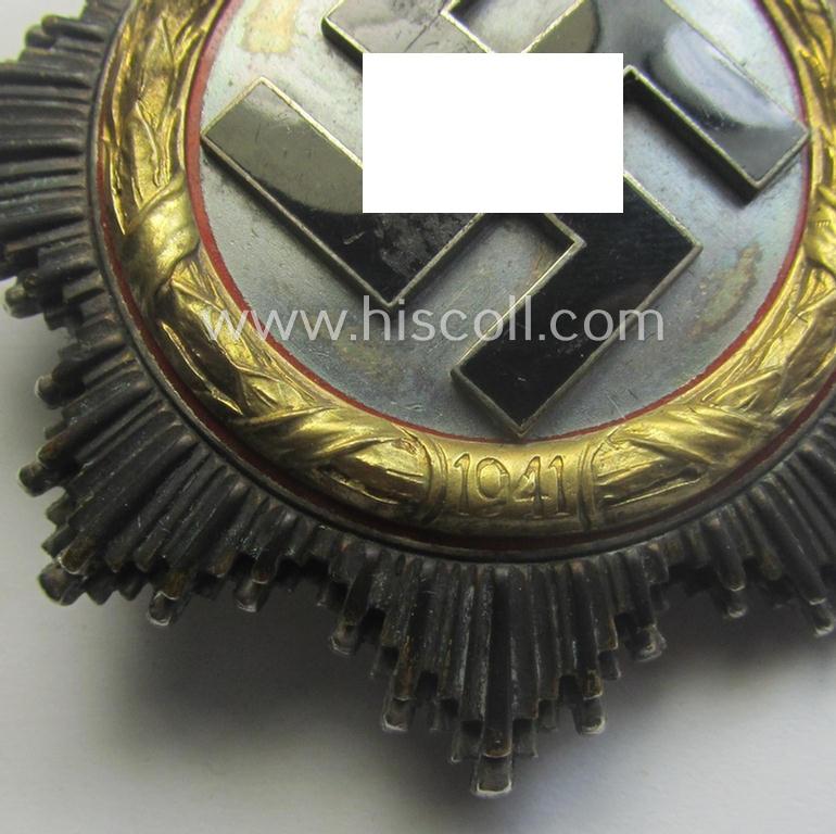 Attractive, neatly maker- (ie. '20'-marked-) example of WH (Heeres, LW etc.) 'Deutsches Kreuz im Gold' (or DKiG) being a (regular- ie. 'light-weight') piece that was produced by the: 'C.F. Zimmermann'-company